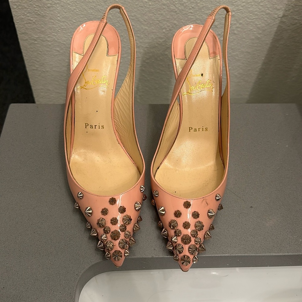 Salmon louboutin studded heels